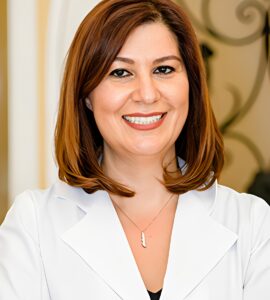 Dr Ravon Smiling Portrait Image in a Coat