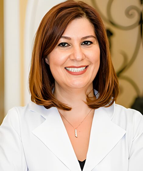 Dr Ravon Smiling Portrait Image in a Coat